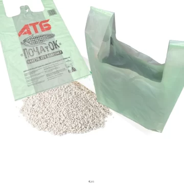 Green biodegradable plastic bags made from plant-based materials.